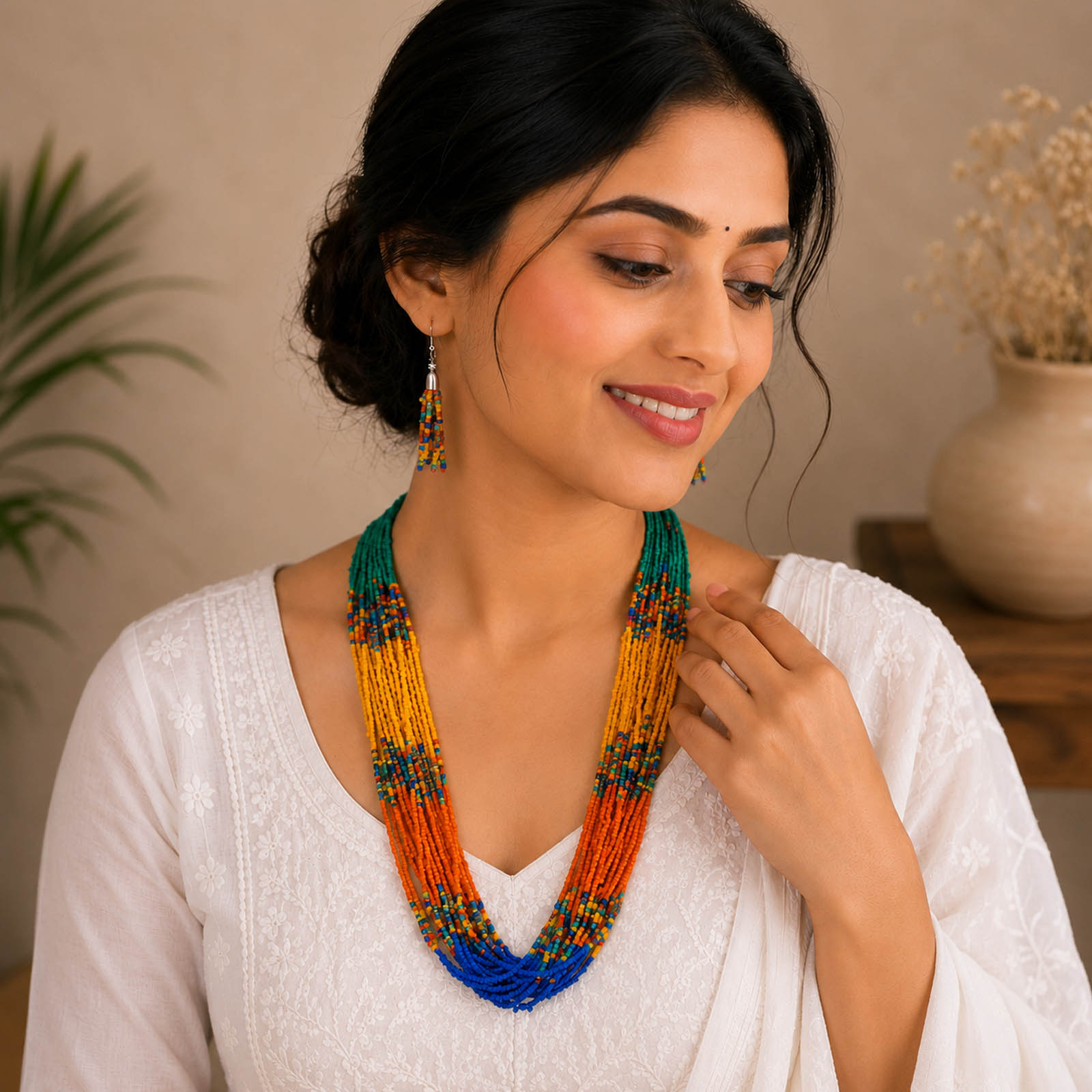 Multicolor layered beaded necklace set with matching tassel earrings featuring teal green, yellow, orange and blue seed beads for women