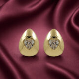 Golden teardrop Anti Tarnish stud earrings with heart-shaped clear stones from Miraya Creations.